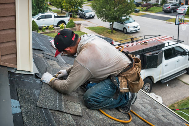 Professional Roofing technician working in Almont, MI